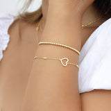 PULSERA CORAZON CALADO GOLD